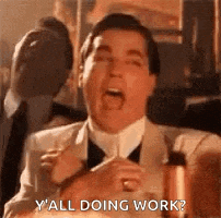 a man in a suit and tie is saying `` y 'all doing work ? '' .