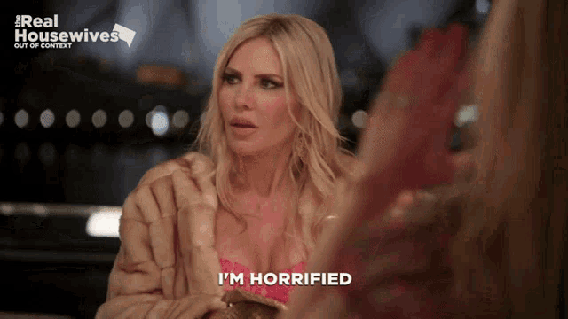 a woman in a fur coat says " i 'm horrific "