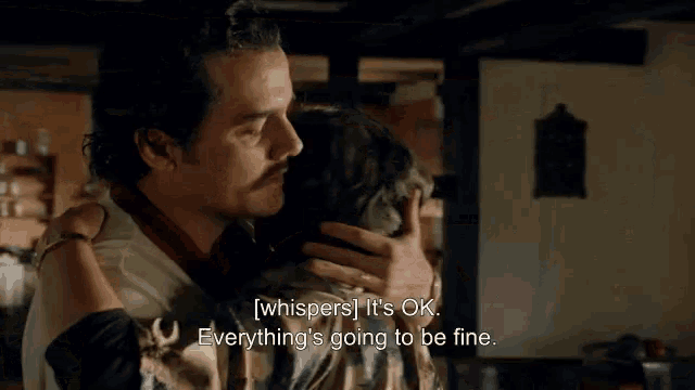 a man is hugging a woman in a room and the woman is saying everything 's going to be fine .