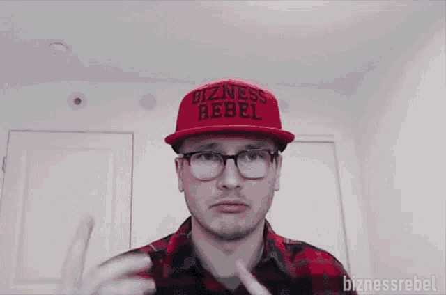 a man wearing a red hat and glasses says you know what to do