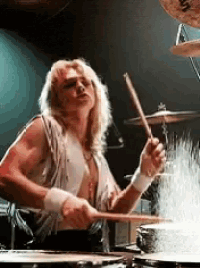a man is playing drums with a cymbal that says sabian