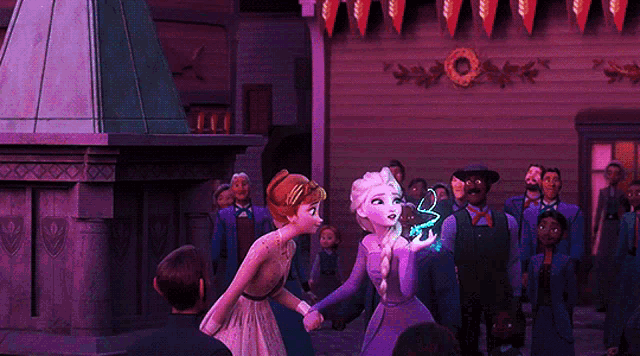 elsa and anna are holding hands in front of a crowd of people