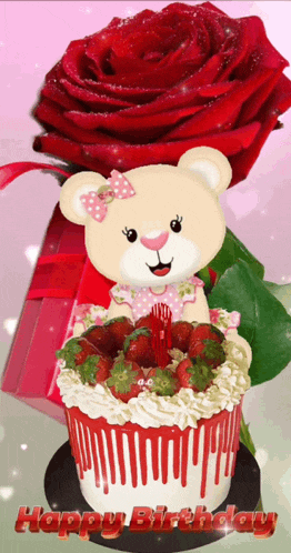 a teddy bear is sitting on top of a birthday cake with strawberries and a red rose