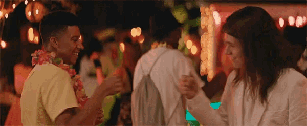 a group of people are dancing together at a party and having fun .