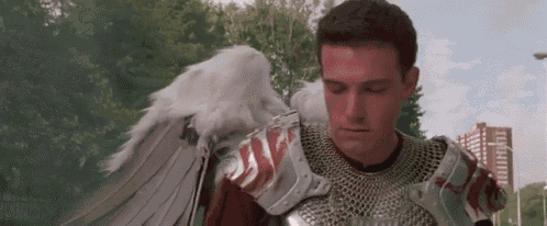 a man with angel wings is wearing a knight 's armor