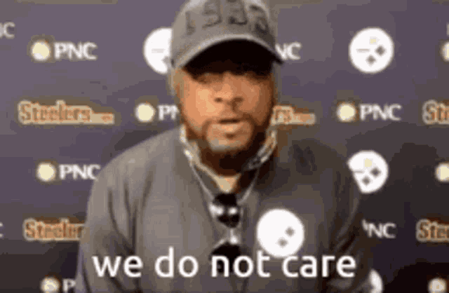 a man wearing a hat and a necklace says we do not care
