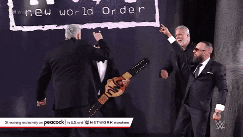 three men in suits are standing in front of a sign that says " new world order "