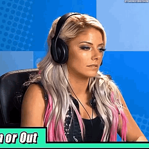 a woman wearing headphones is sitting in a chair on a blue background .