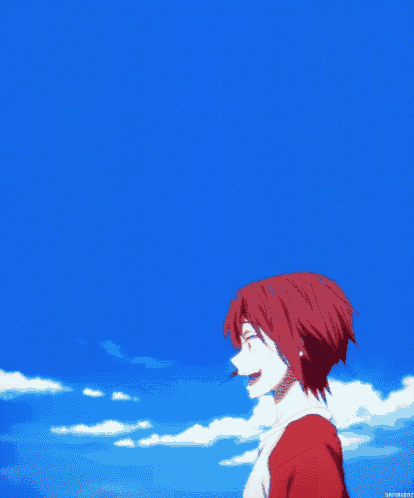 a boy with red hair is standing in front of a blue sky