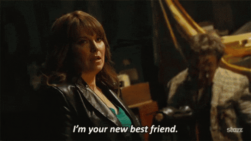 a woman says i 'm your new best friend in front of a man in a suit