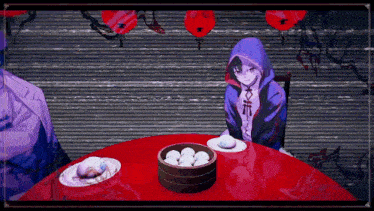 a person in a hoodie sits at a table with a bowl of dumplings on it
