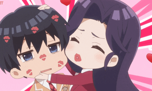 a girl is kissing a boy on the cheek with hearts on his face