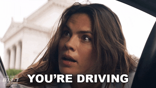 a woman in a car with the words you 're driving below her