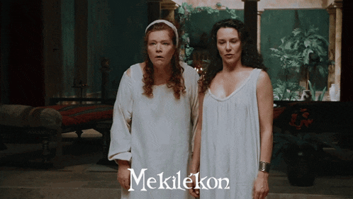 two women standing next to each other with the word mekielkon on the bottom