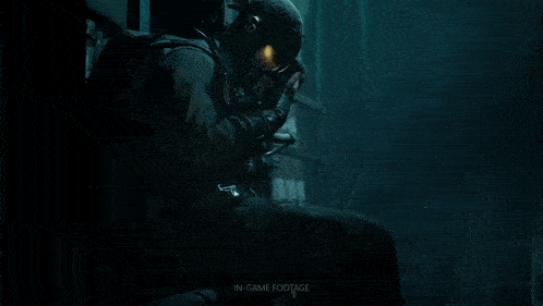 a red background with a person wearing a gas mask with the letter t on it