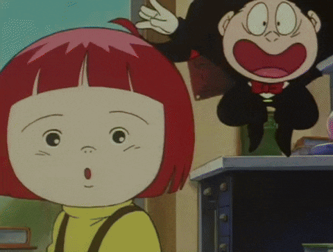 a girl with red hair is standing next to a boy with black hair