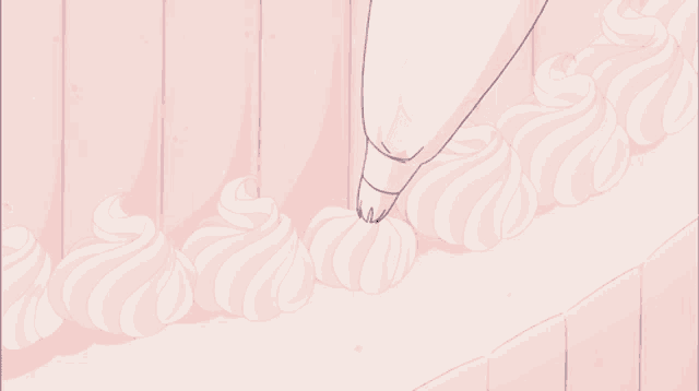 a person is piping whipped cream on a cake