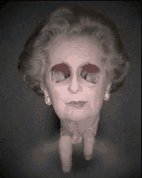 a close up of a woman 's face with a hole in it
