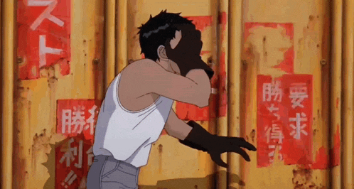 a man in a white tank top is standing in front of a yellow wall with chinese writing on it