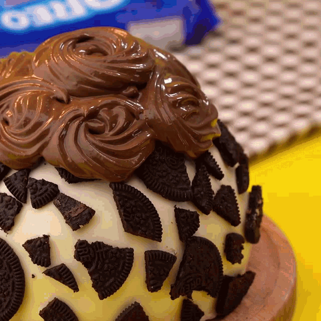 a cake with chocolate frosting and oreo cookies on it