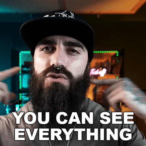 a man with a beard wearing a hat and a nose ring says you can see everything