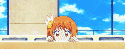 a girl with orange hair and a flower in her hair is peeking out from behind a wall .