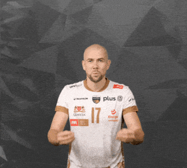 a man wearing a white shirt with the number 17 on the front