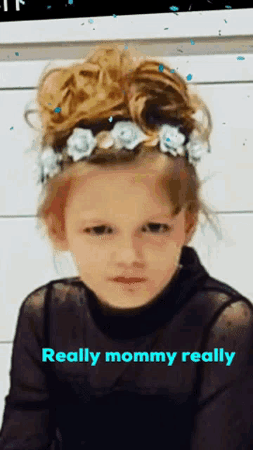 a little girl with a flower crown on her head and the words really mommy really below her