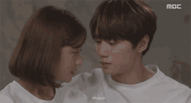 a man and a woman kissing with the word mbc on the bottom right