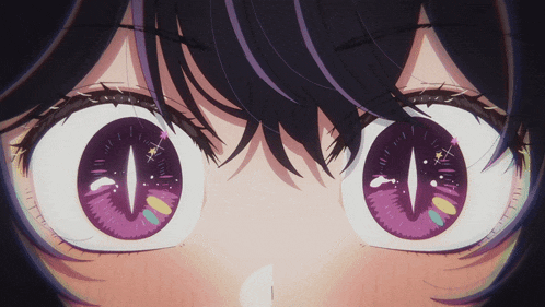a close up of a girl 's eyes with a purple pupil