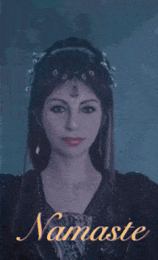 a woman in a black dress with the word namaste on the bottom