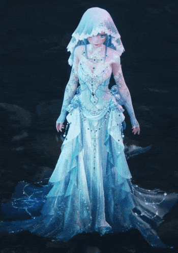 a woman in a blue dress with a white veil