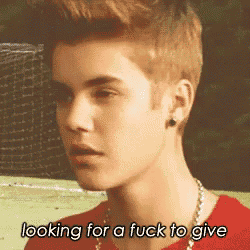 justin bieber is looking for a fuck to give and is wearing a red shirt