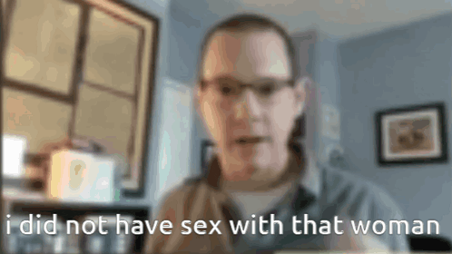 a blurry picture of a man with the words " i did not have sex with that woman " below him