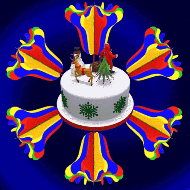 a colorful christmas cake with santa and reindeer on top