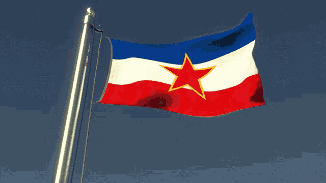 a blue white and red flag with a red star on it