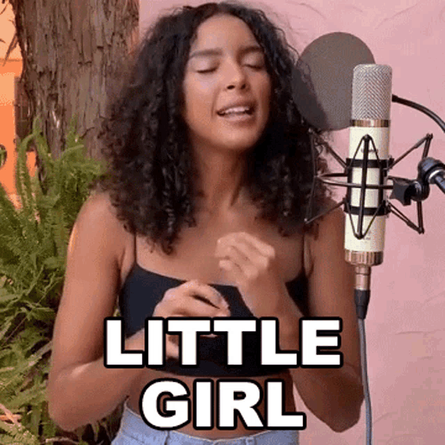 a woman singing into a microphone with the words little girl written on the bottom