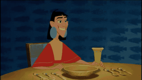 a cartoon character laying on a table with a bowl of food