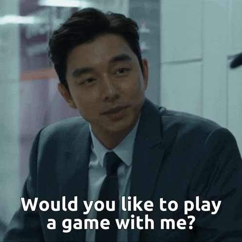 a man in a suit and tie is asking if he would like to play a game with him
