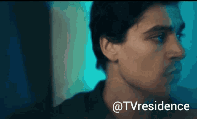 a close up of a man 's face with the words " @tvresidence " below it