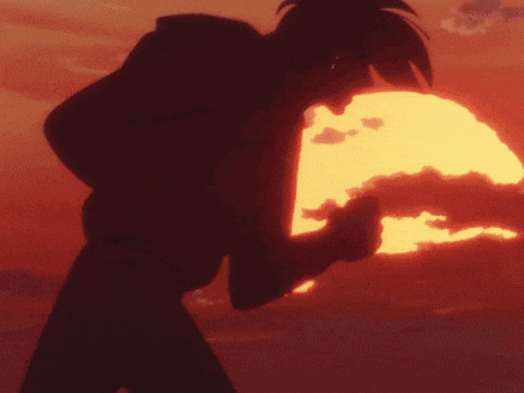 a silhouette of a person standing in front of a sun