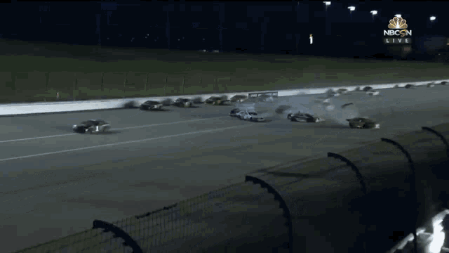 a race track with cars on it and a nbc sign in the background
