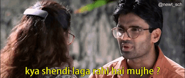a man wearing glasses is talking to a woman with the caption kya shendi laga rahi hai mujhe