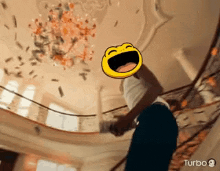 a man is standing on a staircase with a laughing face on his head and money falling from the ceiling .