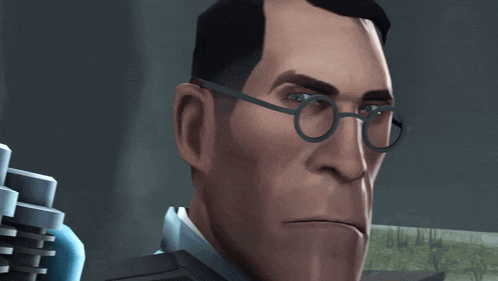 a close up of a man wearing glasses making a face