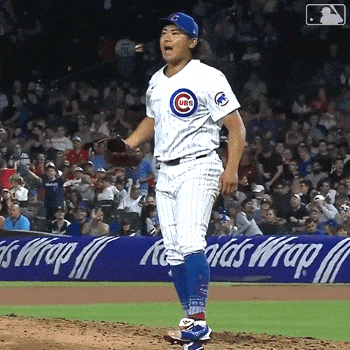 a baseball player with a cubs jersey on