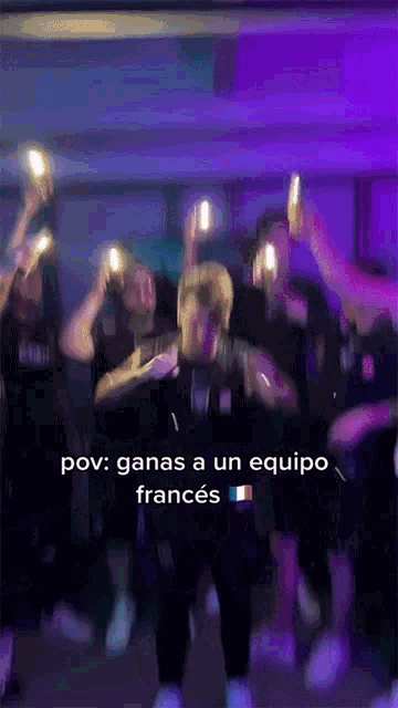 a group of people are dancing in a room with a caption that says pov ganas a un equipo frances