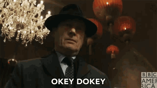 a man in a suit and hat says " okey dokey "