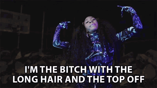 a woman with long hair and the words " i 'm the bitch with the long hair and the top off " above her