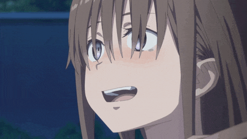 a close up of a girl 's face with a surprised expression